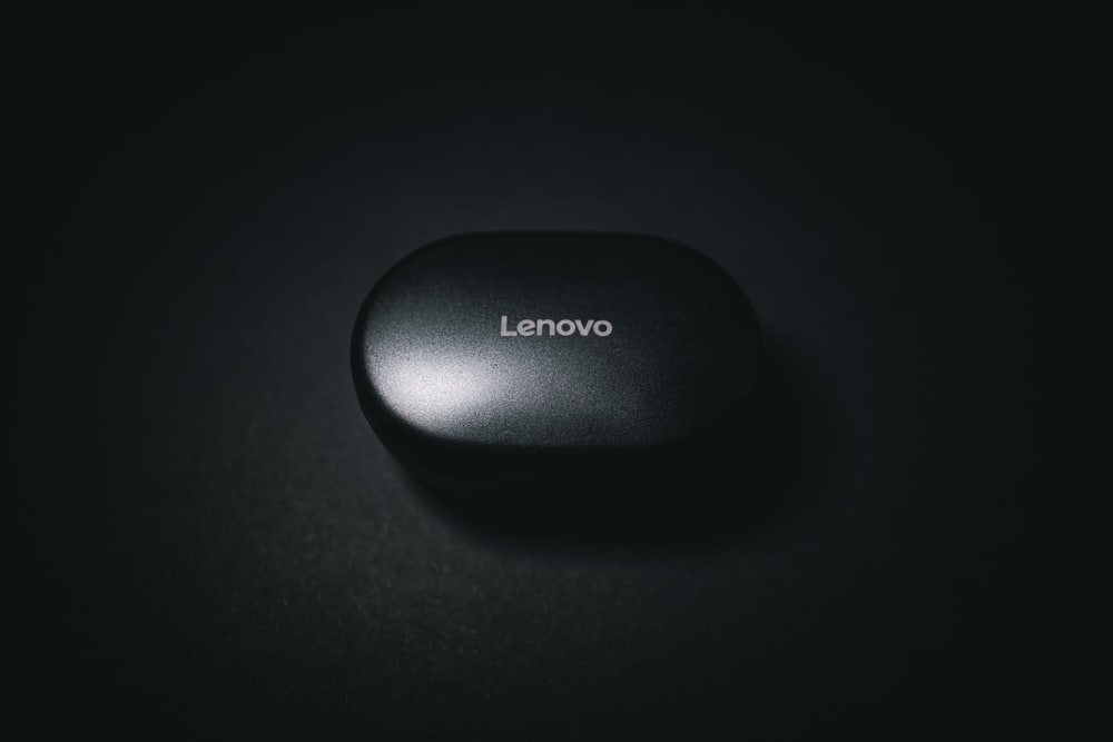 black lenovo laptop computer on white surface